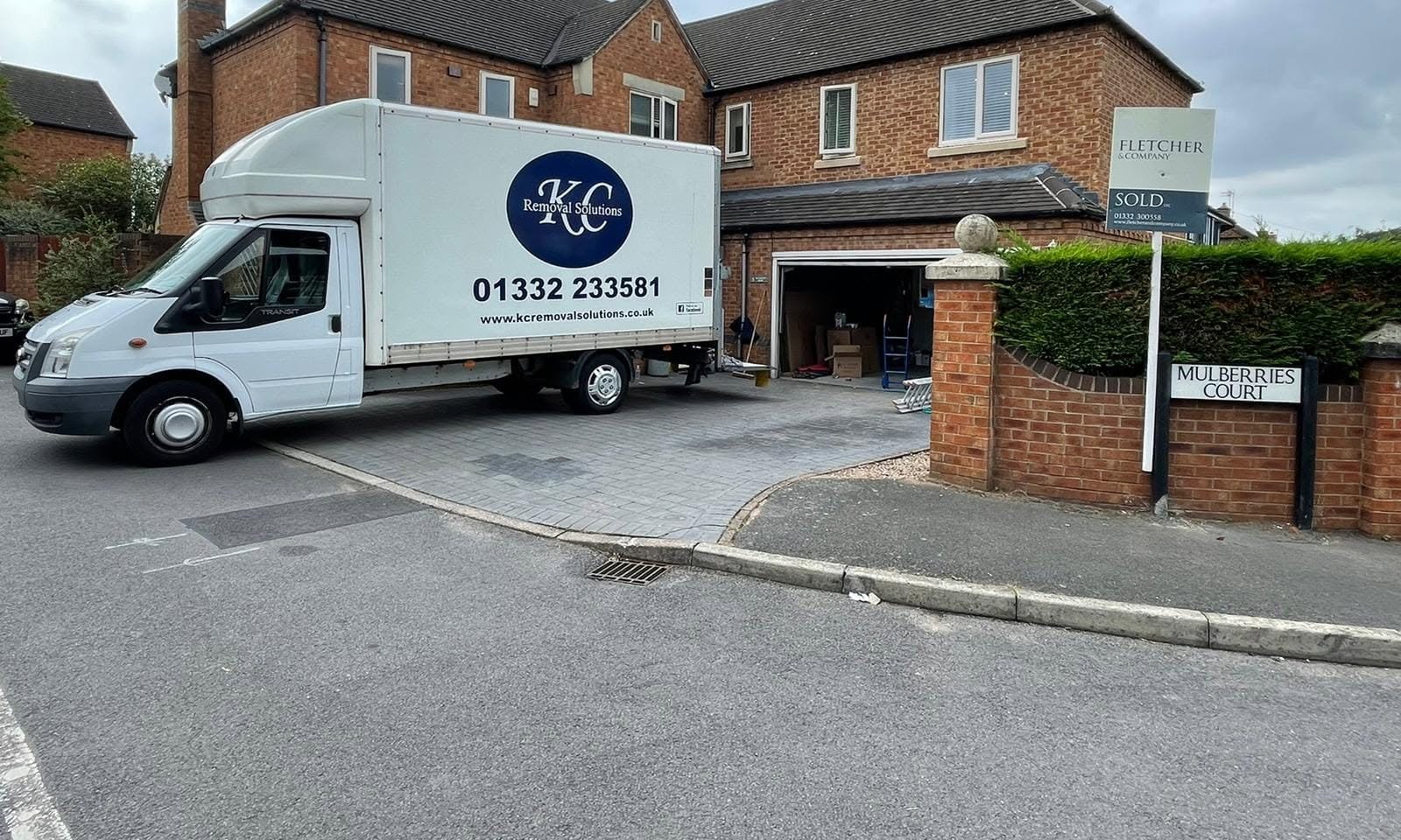 KC Removal Solutions van outside a sold Derby property